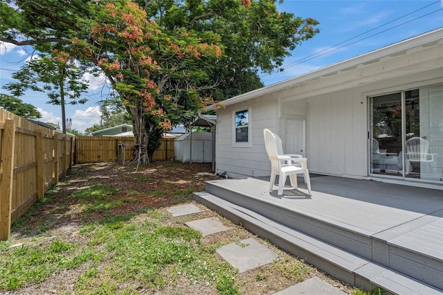 3310 W 9th Ave, Bradenton, FL 34205 - fenced backyard with a wooden deck