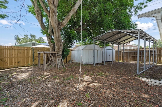 3310 W 9th Ave, Bradenton, FL 34205 - fenced backyard with a storage shed and a carport
