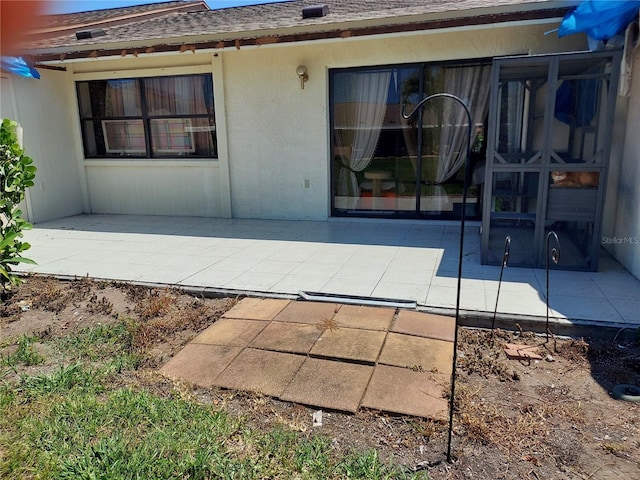 6132 29th Ave W, Bradenton, FL 34209 - back of house with a patio and a shingled roof