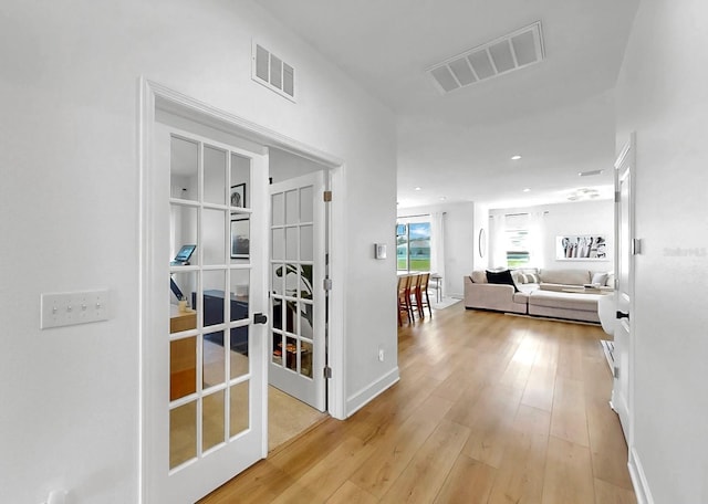 6120 115th Ave E, Parrish, FL 34219 - corridor featuring french doors, light wood-style flooring, and recessed lighting