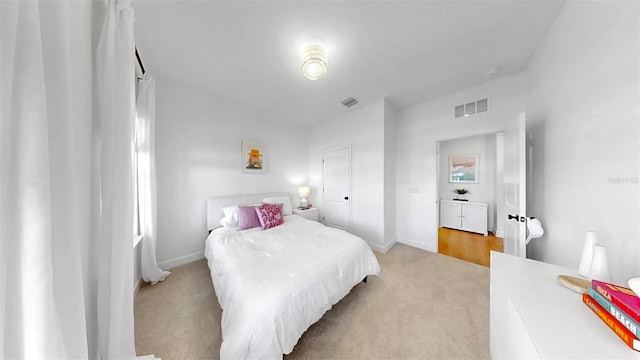 6120 115th Ave E, Parrish, FL 34219 - bedroom featuring light colored carpet and baseboards