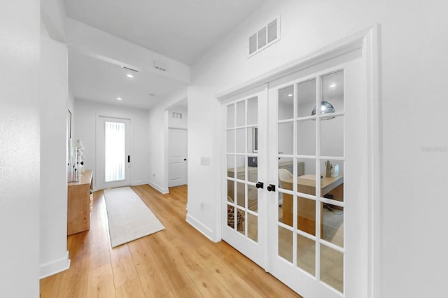 6120 115th Ave E, Parrish, FL 34219 - doorway to outside with french doors, light wood-style floors, and recessed lighting