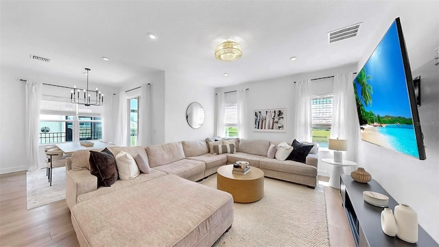 6120 115th Ave E, Parrish, FL 34219 - living room with a chandelier, light wood-type flooring, and recessed lighting