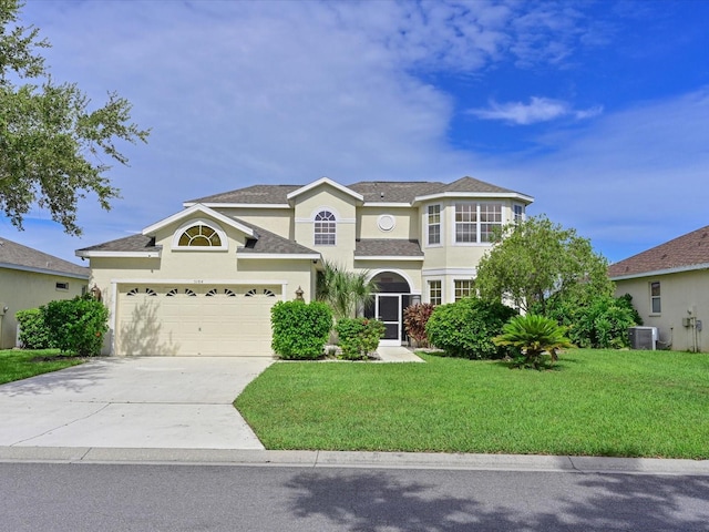 5184 51st Ln W, Bradenton, FL 34210 - traditional-style home featuring concrete driveway, a front yard, stucco siding, and a garage