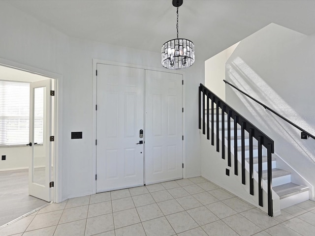 5184 51st Ln W, Bradenton, FL 34210 - foyer entrance with a chandelier, stairway, and tile patterned floors