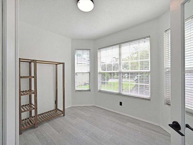 5184 51st Ln W, Bradenton, FL 34210 - spare room with wood finished floors and a textured ceiling