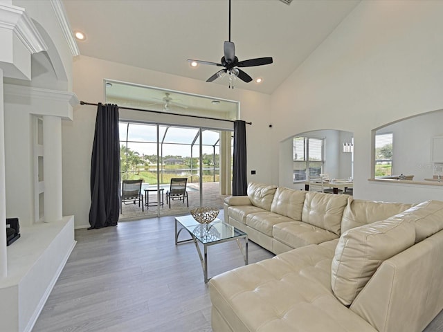 5184 51st Ln W, Bradenton, FL 34210 - living area with a ceiling fan, arched walkways, recessed lighting, light wood-type flooring, and a sunroom