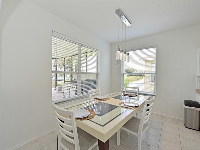 5184 51st Ln W, Bradenton, FL 34210 - dining area with baseboards and light tile patterned floors