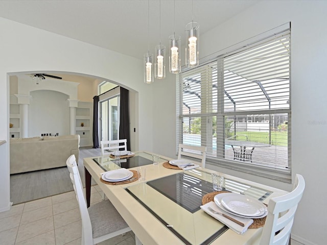5184 51st Ln W, Bradenton, FL 34210 - dining room with arched walkways, light tile patterned flooring, and a ceiling fan