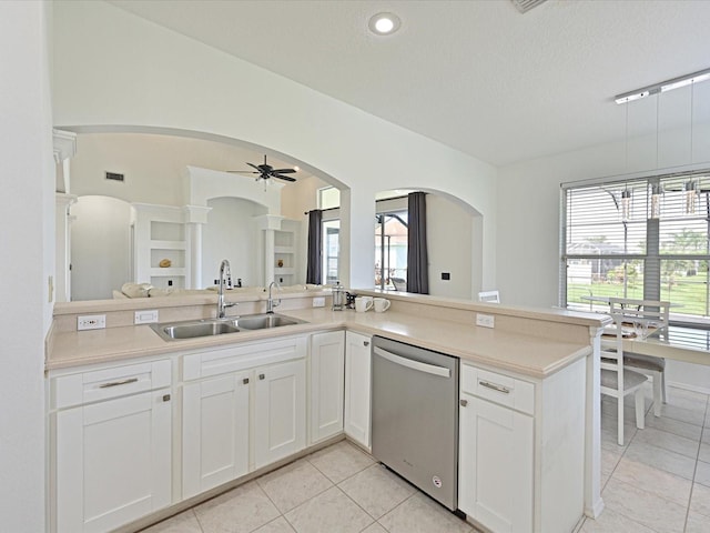 5184 51st Ln W, Bradenton, FL 34210 - kitchen featuring stainless steel dishwasher, arched walkways, ceiling fan, light tile patterned floors, and a textured ceiling