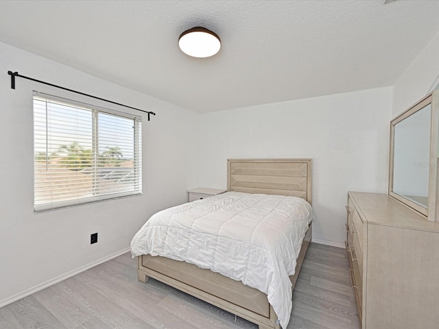 5184 51st Ln W, Bradenton, FL 34210 - bedroom featuring light wood-style flooring and baseboards