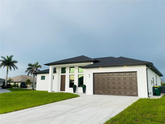 9150 Key W St, Port Charlotte, FL 33981 - prairie-style house featuring stucco siding, an attached garage, concrete driveway, and a front yard