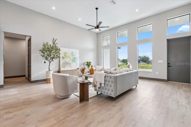 9150 Key W St, Port Charlotte, FL 33981 - living area featuring a high ceiling, a ceiling fan, light wood-style flooring, and recessed lighting