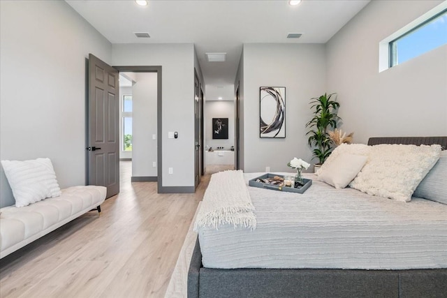 9150 Key W St, Port Charlotte, FL 33981 - bedroom featuring light wood-type flooring, recessed lighting, and connected bathroom