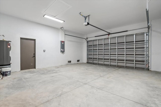 9150 Key W St, Port Charlotte, FL 33981 - garage with electric panel, a garage door opener, and water heater