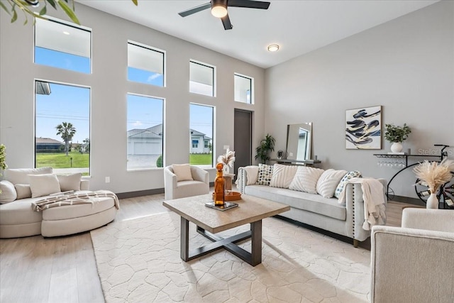 9150 Key W St, Port Charlotte, FL 33981 - living area featuring a towering ceiling, a ceiling fan, and light wood finished floors