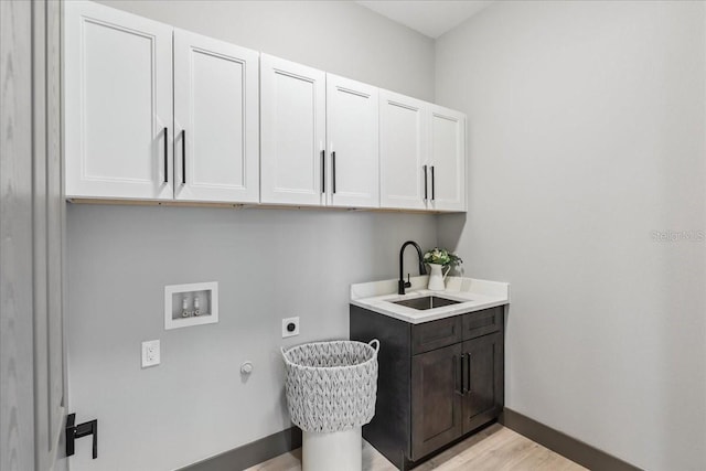 9150 Key W St, Port Charlotte, FL 33981 - washroom featuring cabinet space, electric dryer hookup, washer hookup, and light wood finished floors