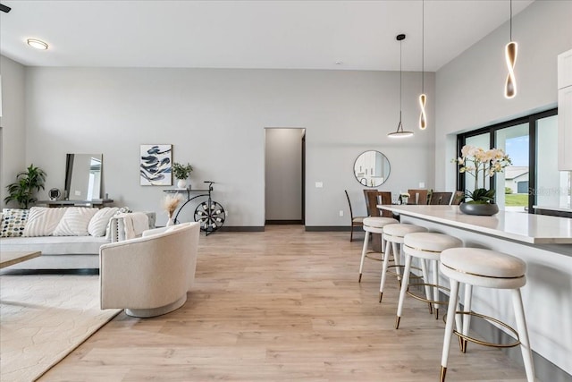 9150 Key W St, Port Charlotte, FL 33981 - living area featuring a towering ceiling and light wood-type flooring