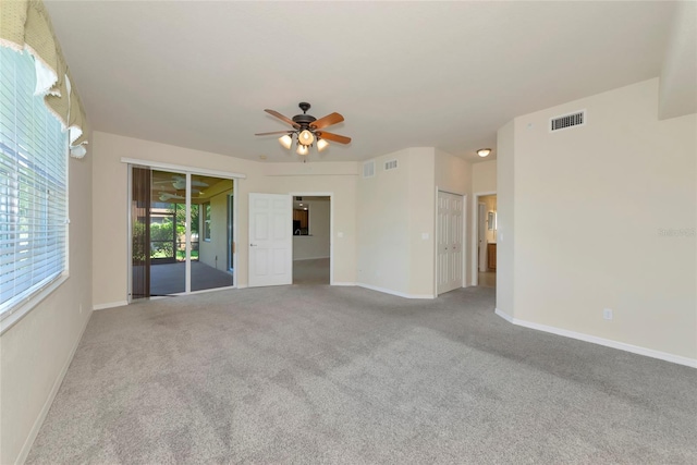 318 Winding Brook Ln Unit 104, Bradenton, FL 34212 - spare room with carpet flooring and a ceiling fan
