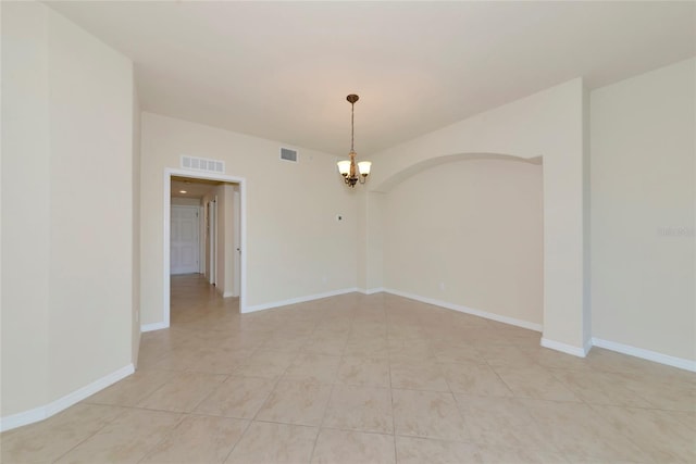 318 Winding Brook Ln Unit 104, Bradenton, FL 34212 - empty room with a chandelier and light tile patterned flooring