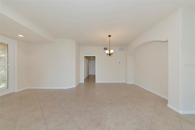 318 Winding Brook Ln Unit 104, Bradenton, FL 34212 - spare room featuring a chandelier and light tile patterned floors