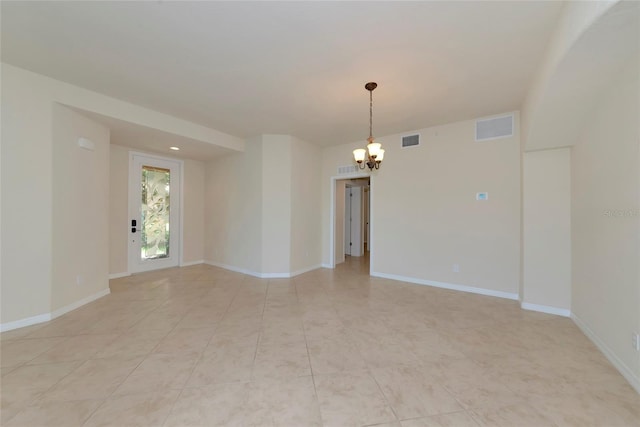 318 Winding Brook Ln Unit 104, Bradenton, FL 34212 - unfurnished room featuring a chandelier and baseboards