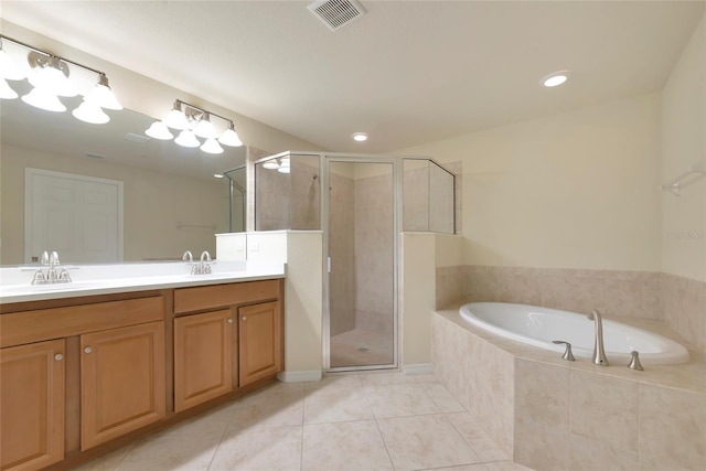 318 Winding Brook Ln Unit 104, Bradenton, FL 34212 - full bath with double vanity, a stall shower, a bath, tile patterned floors, and recessed lighting