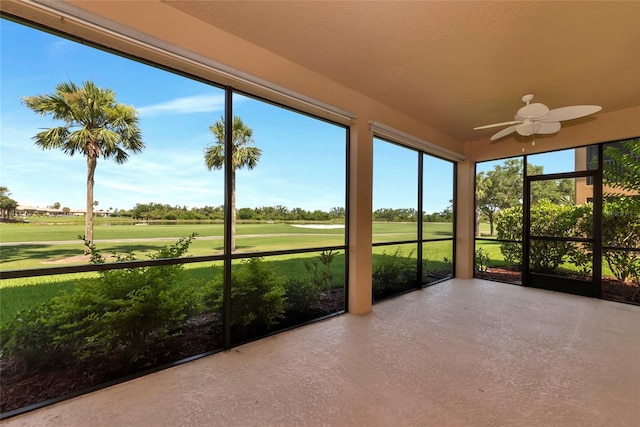 318 Winding Brook Ln Unit 104, Bradenton, FL 34212 - unfurnished sunroom featuring view of golf course and finished concrete flooring