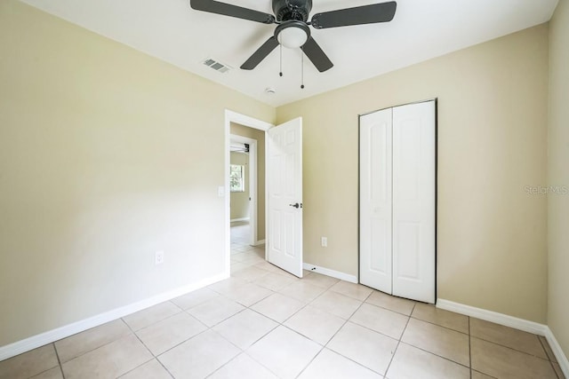 314 W Owens Ave, Arcadia, FL 34266 - unfurnished bedroom featuring a closet, light tile patterned floors, and ceiling fan