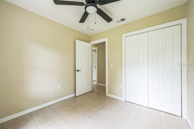 314 W Owens Ave, Arcadia, FL 34266 - unfurnished bedroom with light tile patterned floors, a closet, and a ceiling fan