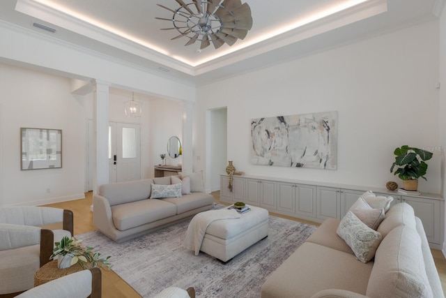 16511 Cornwall Ln, Lakewood Ranch, FL 34202 - living area with a tray ceiling and decorative columns