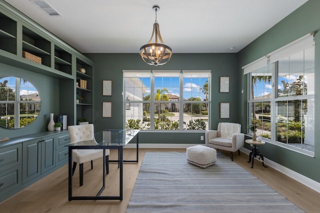16511 Cornwall Ln, Lakewood Ranch, FL 34202 - office area with a chandelier, healthy amount of natural light, and light wood-type flooring
