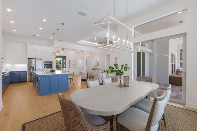 16511 Cornwall Ln, Lakewood Ranch, FL 34202 - dining room featuring recessed lighting, light wood-type flooring, and a chandelier
