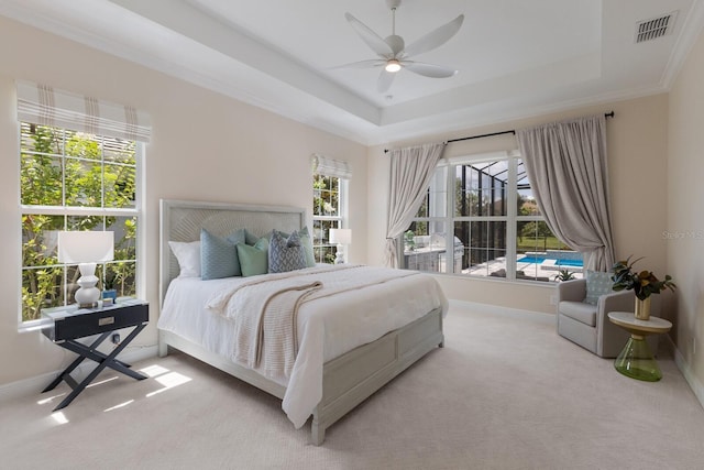 16511 Cornwall Ln, Lakewood Ranch, FL 34202 - carpeted bedroom featuring a tray ceiling and a ceiling fan