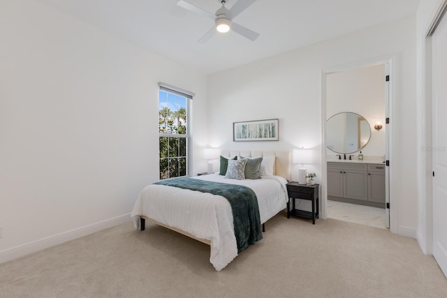 16511 Cornwall Ln, Lakewood Ranch, FL 34202 - bedroom with light carpet, ensuite bathroom, and a ceiling fan