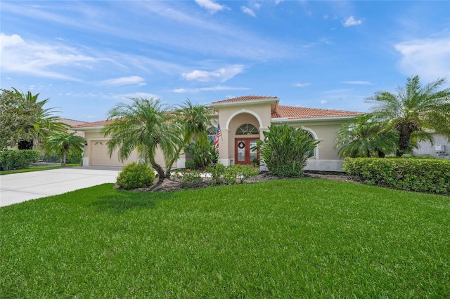 2937 Seasons Blvd, Sarasota, FL 34240 - mediterranean / spanish home with a tile roof, concrete driveway, stucco siding, an attached garage, and a front yard