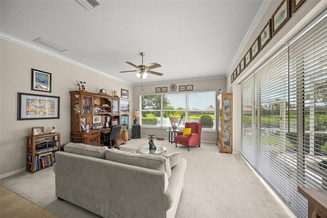 2937 Seasons Blvd, Sarasota, FL 34240 - living room with ornamental molding, a ceiling fan, an office area, and light colored carpet
