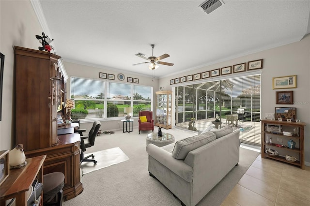 2937 Seasons Blvd, Sarasota, FL 34240 - living room featuring a desk, ornamental molding, a ceiling fan, and light tile patterned floors