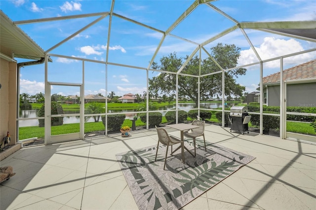 2937 Seasons Blvd, Sarasota, FL 34240 - view of patio with grilling area, a water view, glass enclosure, and a residential view