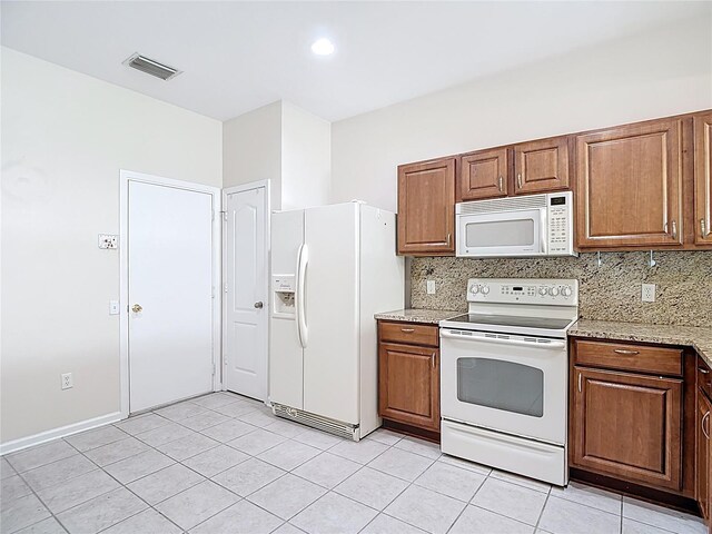 26548 Castleview Way, Wesley Chapel, FL 33544 - kitchen featuring white appliances, light tile patterned floors, tasteful backsplash, and light stone counters