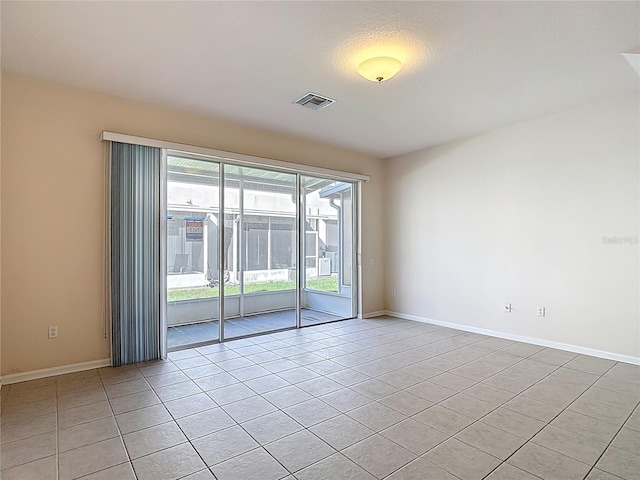 26548 Castleview Way, Wesley Chapel, FL 33544 - spare room featuring light tile patterned flooring