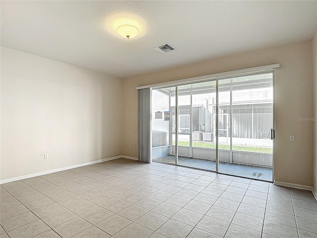 26548 Castleview Way, Wesley Chapel, FL 33544 - unfurnished room with light tile patterned floors and baseboards