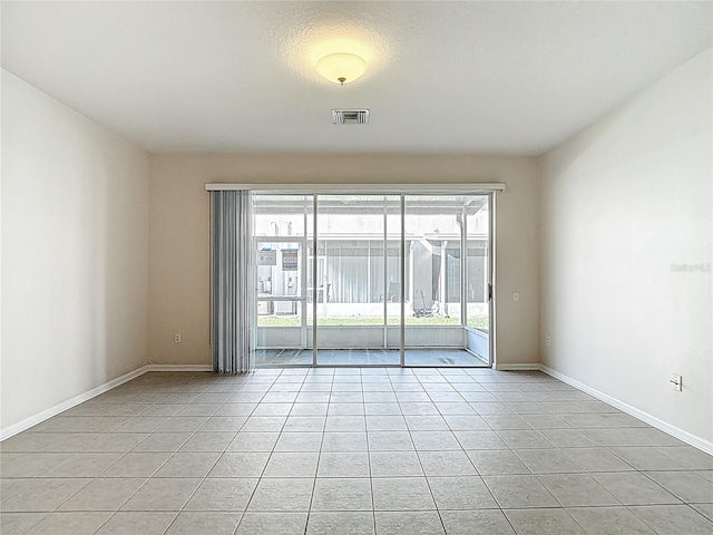 26548 Castleview Way, Wesley Chapel, FL 33544 - spare room with light tile patterned floors and baseboards
