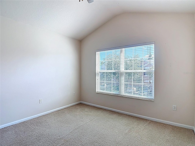 26548 Castleview Way, Wesley Chapel, FL 33544 - empty room featuring lofted ceiling, carpet flooring, and ceiling fan