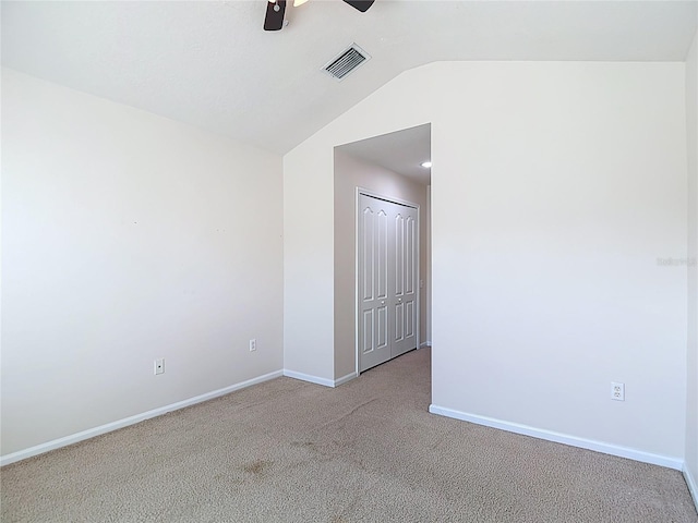 26548 Castleview Way, Wesley Chapel, FL 33544 - spare room featuring ceiling fan, carpet flooring, and vaulted ceiling