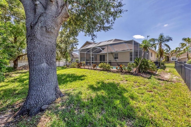 815 Greenview Dr, Apollo Beach, FL 33572 - rear view of property with a fenced backyard and a lanai
