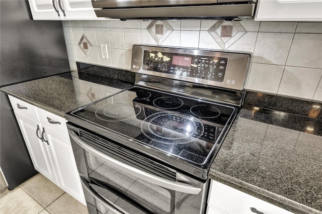 2801 SW 29th Ct, Cape Coral, FL 33914 - kitchen with electric range, backsplash, and white cabinets