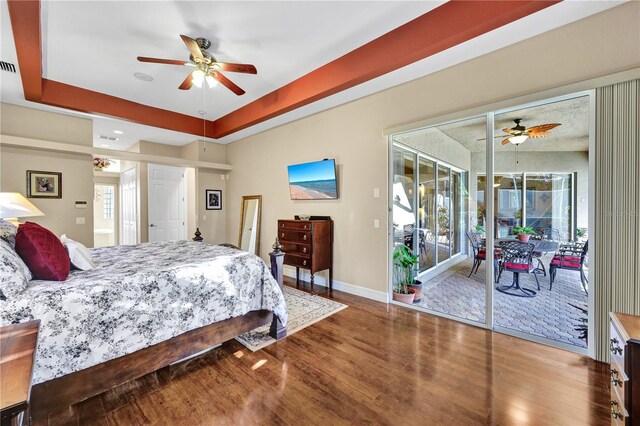 2801 SW 29th Ct, Cape Coral, FL 33914 - bedroom featuring access to exterior, wood finished floors, multiple windows, and ceiling fan