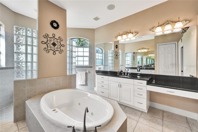 2801 SW 29th Ct, Cape Coral, FL 33914 - bathroom featuring a tub with jets, vanity, and tile patterned floors