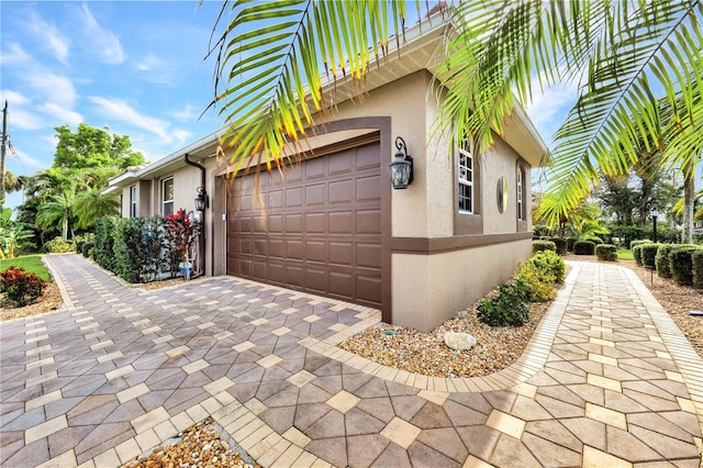 2801 SW 29th Ct, Cape Coral, FL 33914 - view of property exterior with stucco siding and driveway